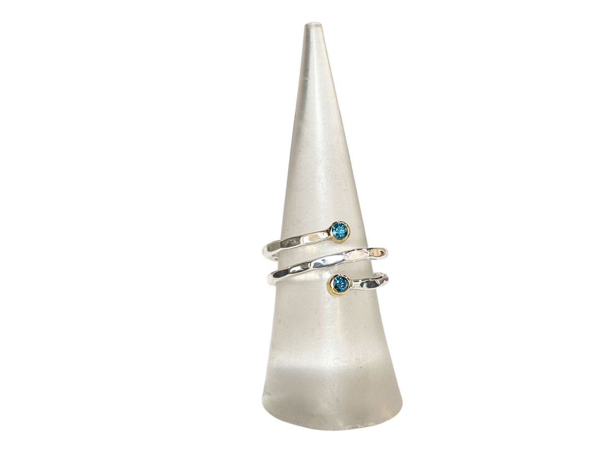 Alternate view of the blue diamond spiral ring in silver and gold