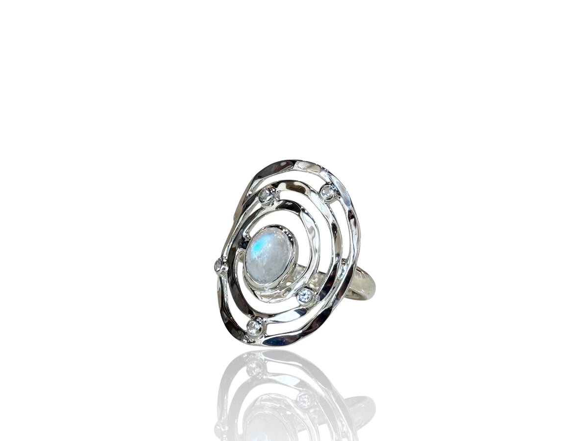 Eye of the Storm sterling silver ring, a swirl of silver circling a moonstone with five white topaz accents