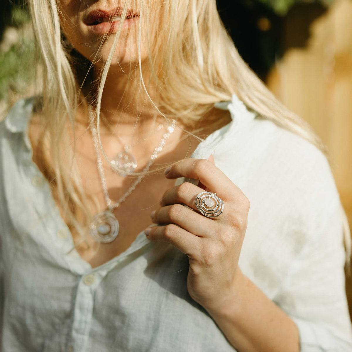 Close-up of the calm moonstone center and white topaz in the Eye of the Storm ring