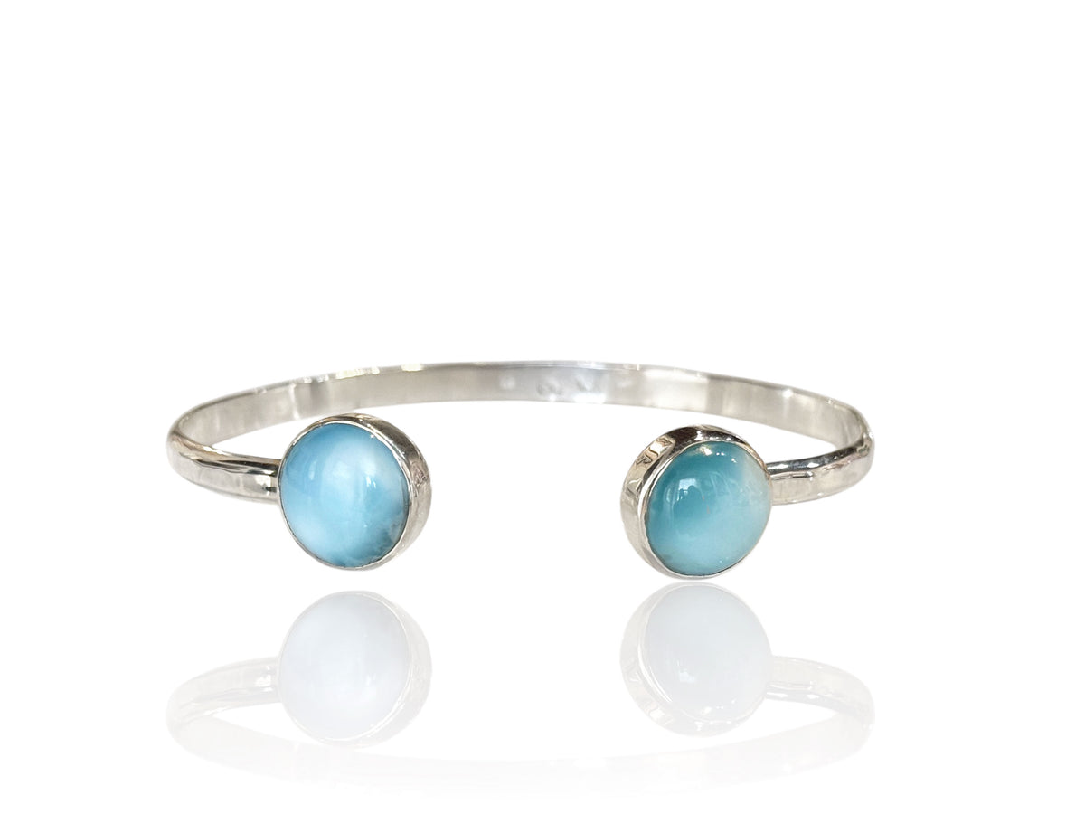 Hammered sterling silver open cuff bracelet with a round Caribbean larimar at each end