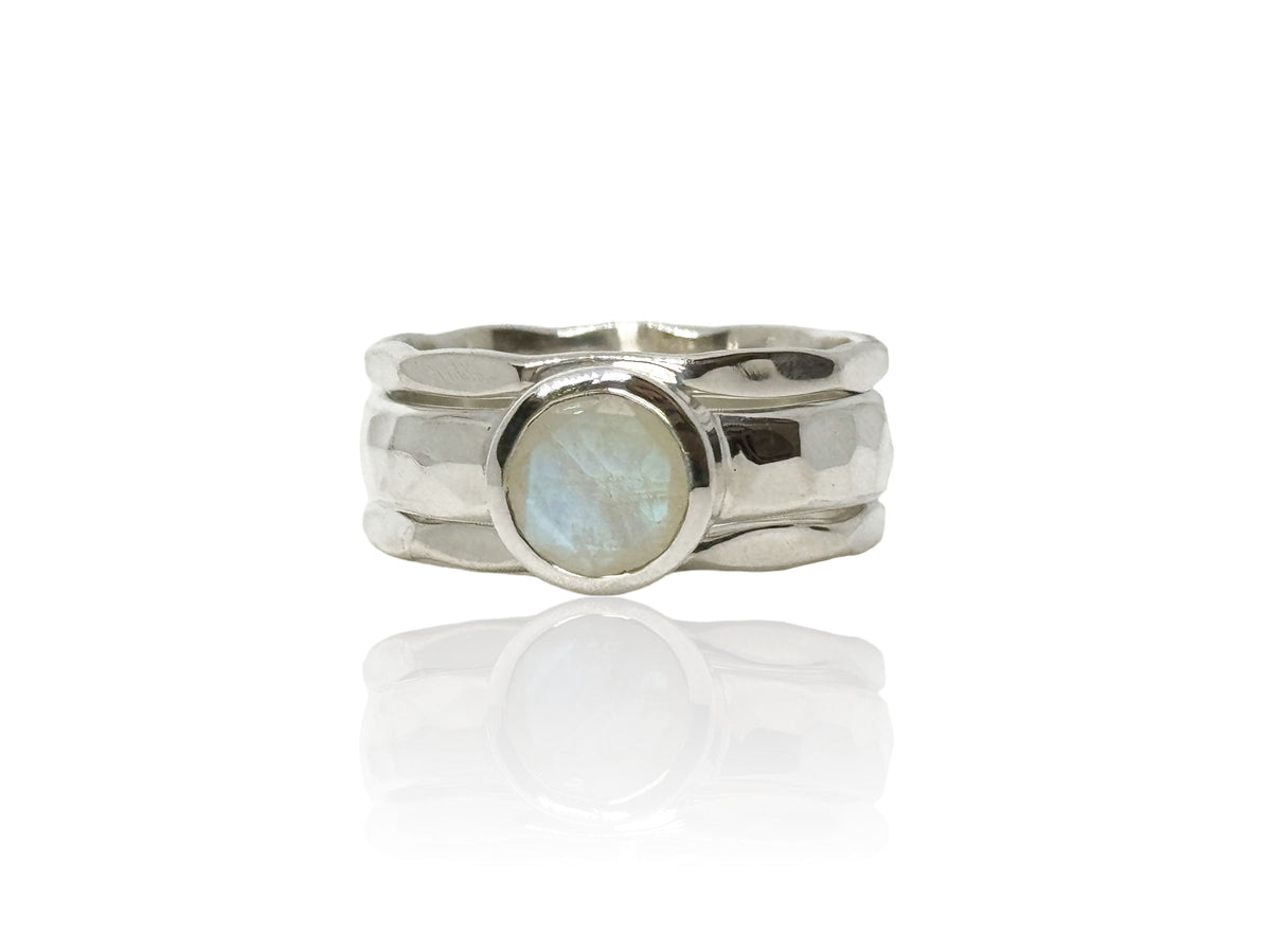 Side view of the moonstone ring showing the hammered silver band