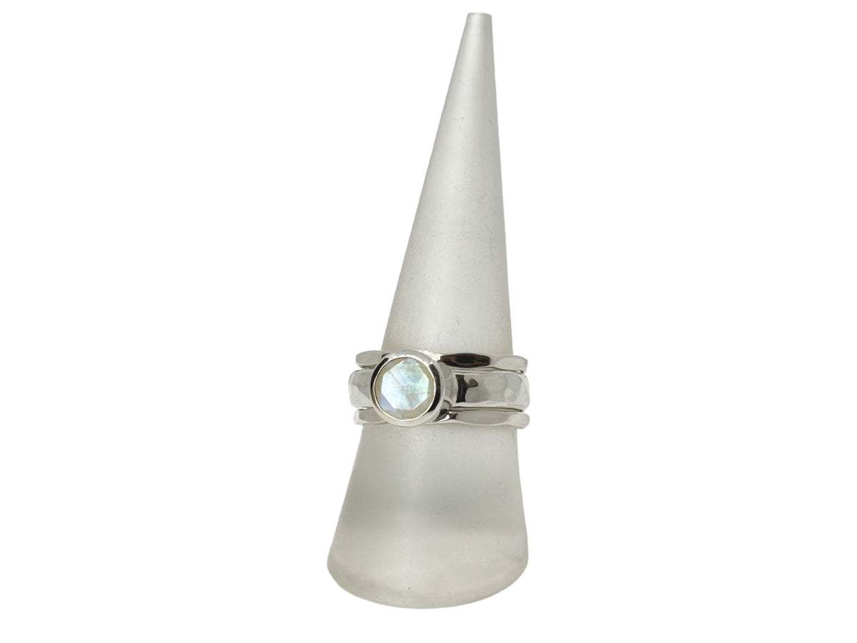 Close-up of the faceted rainbow moonstone in its silver setting