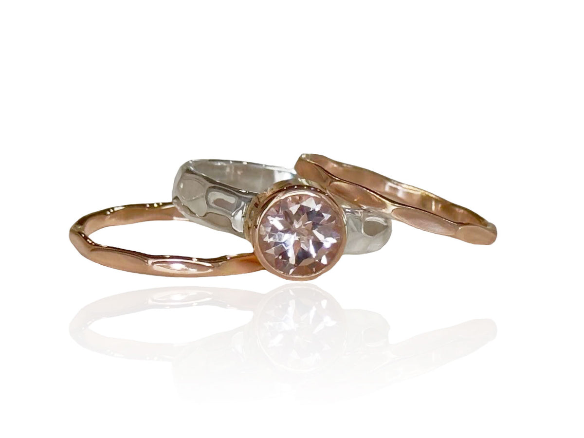 8mm round brilliant-cut pink morganite in a 14kt rose gold bezel on a sterling silver ring