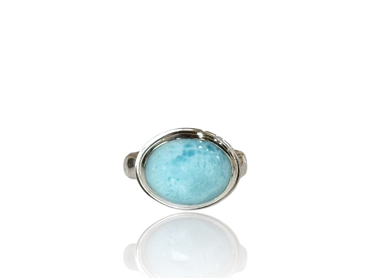Side view of the oval larimar ring showing the hammer-textured band