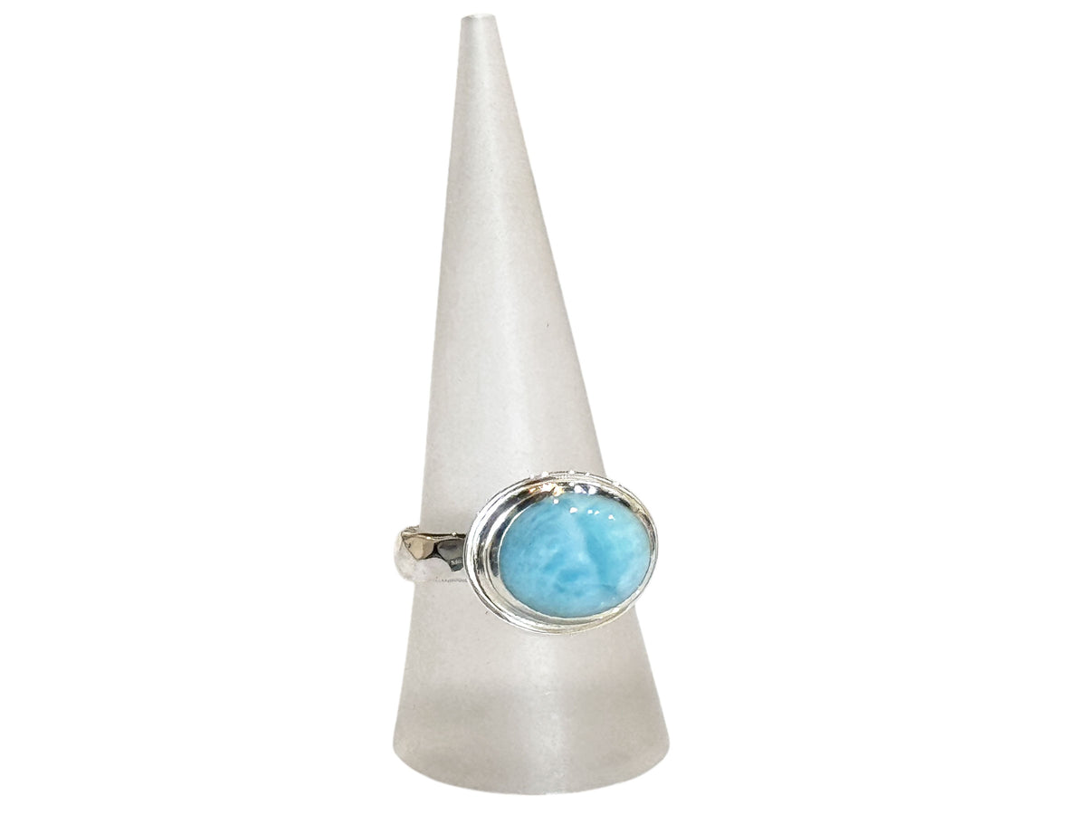 Close-up of the cool blue larimar pattern in its shiny silver setting