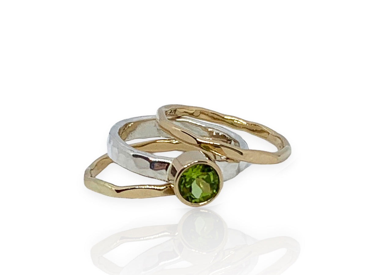 Green peridot Self Love ring in gold on sterling silver, between two accent stack bands