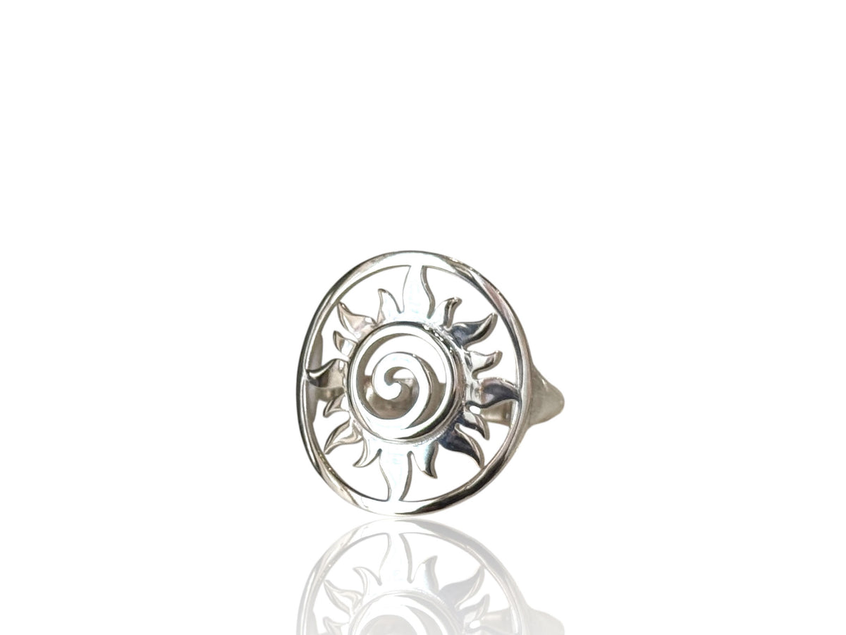 Close-up of the swirling sun design on the silver ring