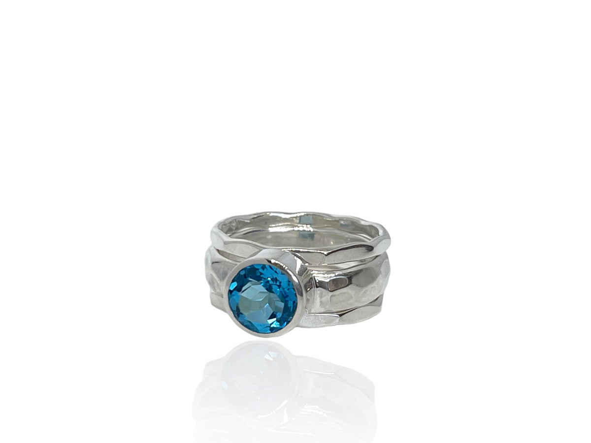 Close-up of the bright Swiss blue topaz in its silver setting