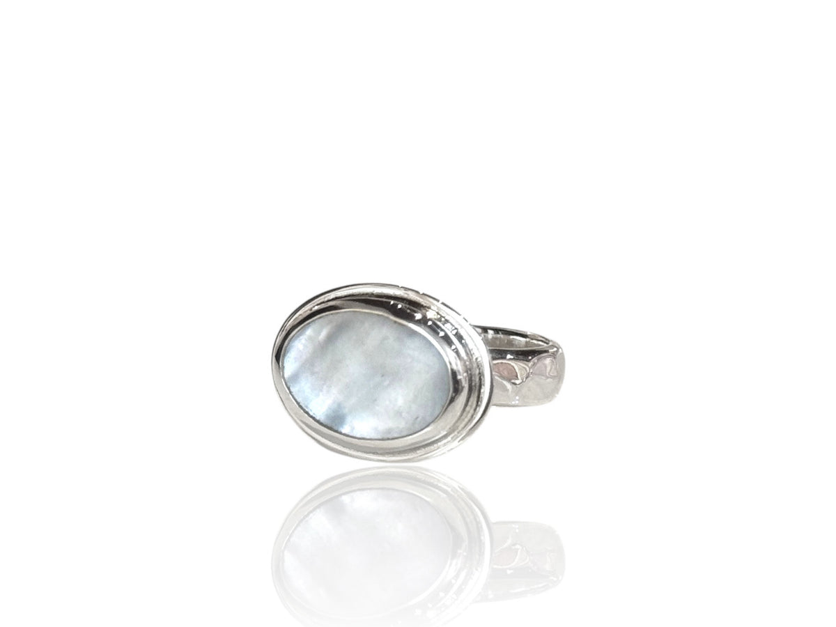 Close-up of the shimmering white mother-of-pearl in its silver setting