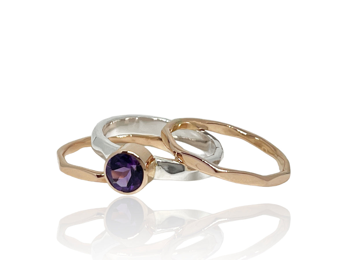 Another angle of the amethyst ring with silver stack bands