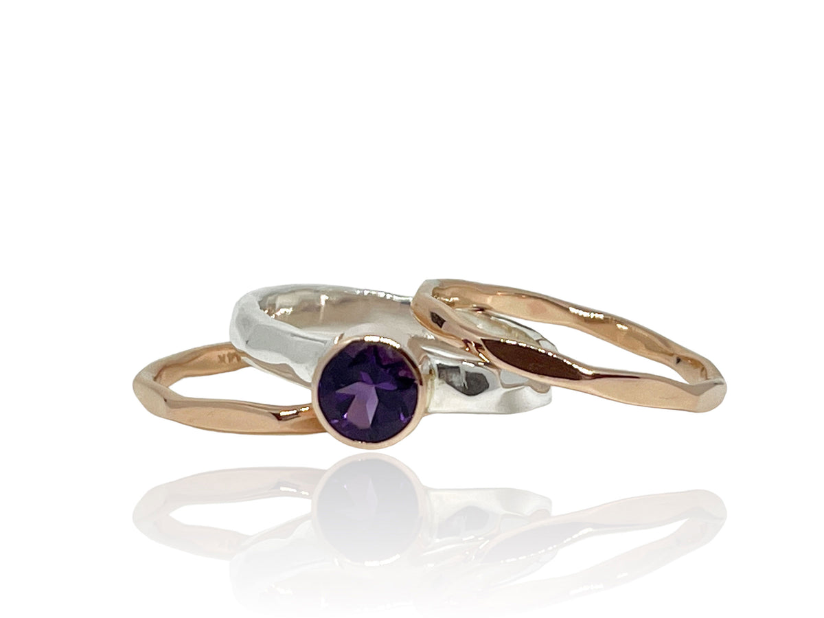 Close-up of the rich purple amethyst in its rose gold setting