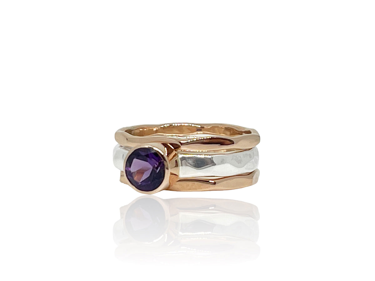 Side view of the amethyst stack ring showing the hammered silver band