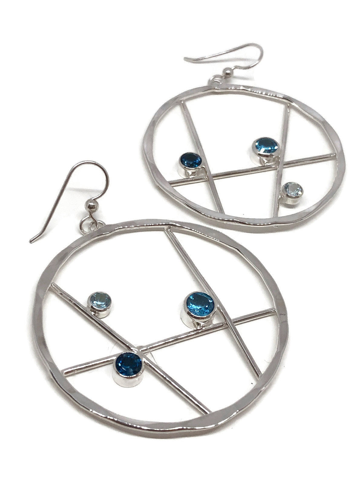 Hammered sterling silver hoop earrings set with sky blue, Swiss blue and London blue topaz