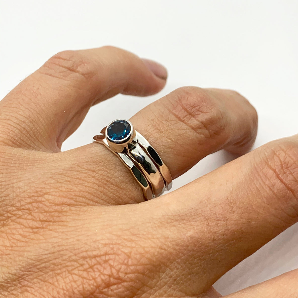 Close-up of the deep London blue topaz in its sterling silver setting