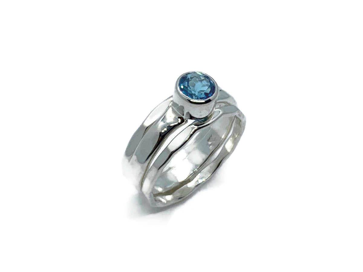 Side view of the blue topaz stack ring showing the hammered silver band