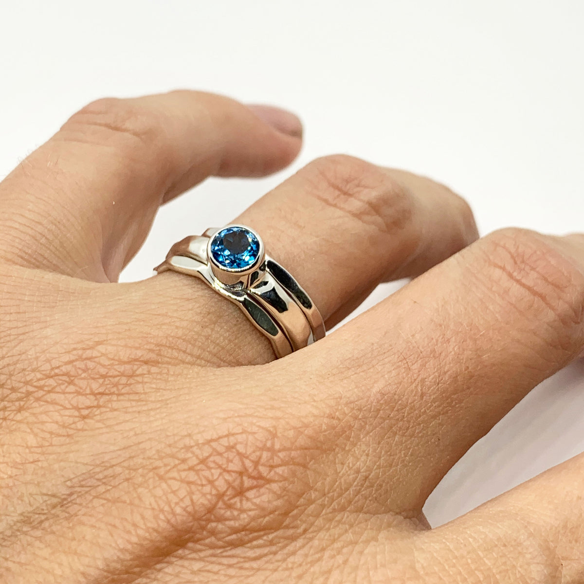 Close-up of the bright Swiss blue topaz in its sterling silver setting