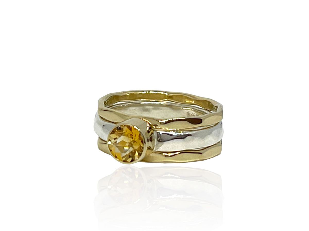Side view of the citrine stack ring showing the hammered silver band
