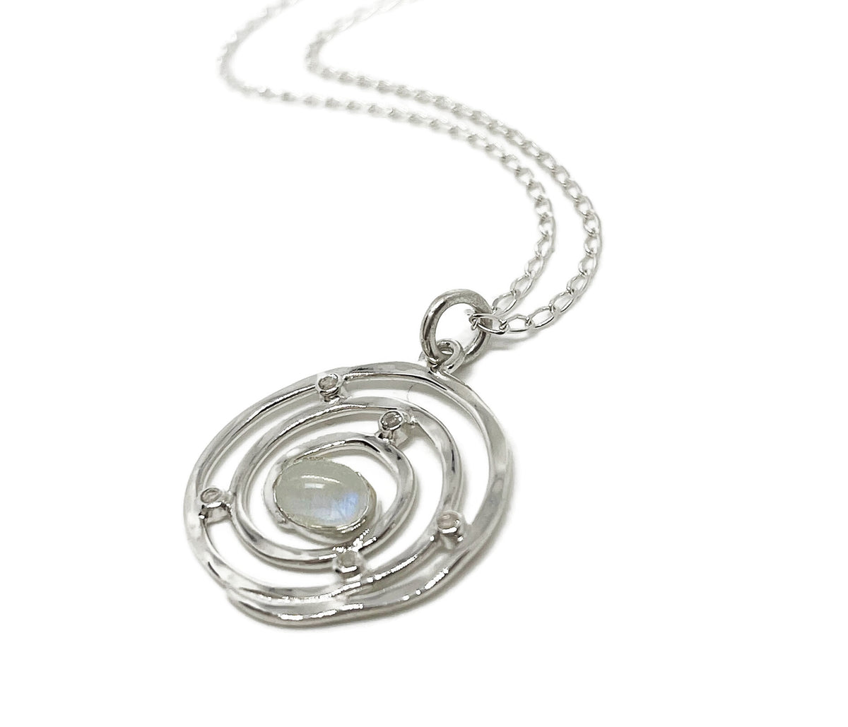 Another angle of the Eye of the Storm swirl pendant in sterling silver