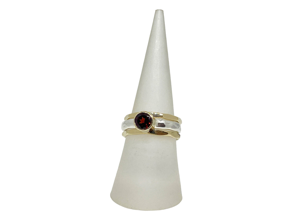 Side view of the garnet stack ring showing the hammered silver band