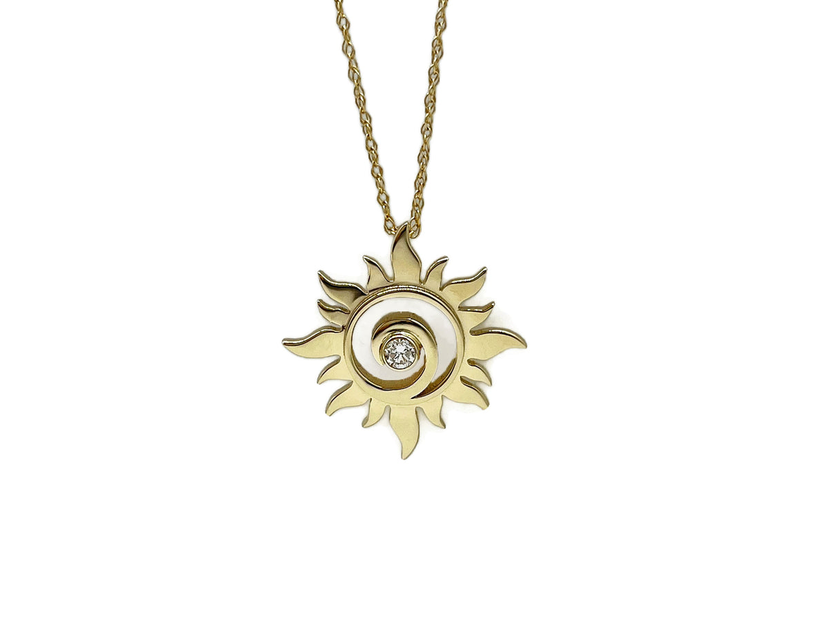 Yellow gold sun swirl pendant with a sparkling brilliant-cut diamond at the center