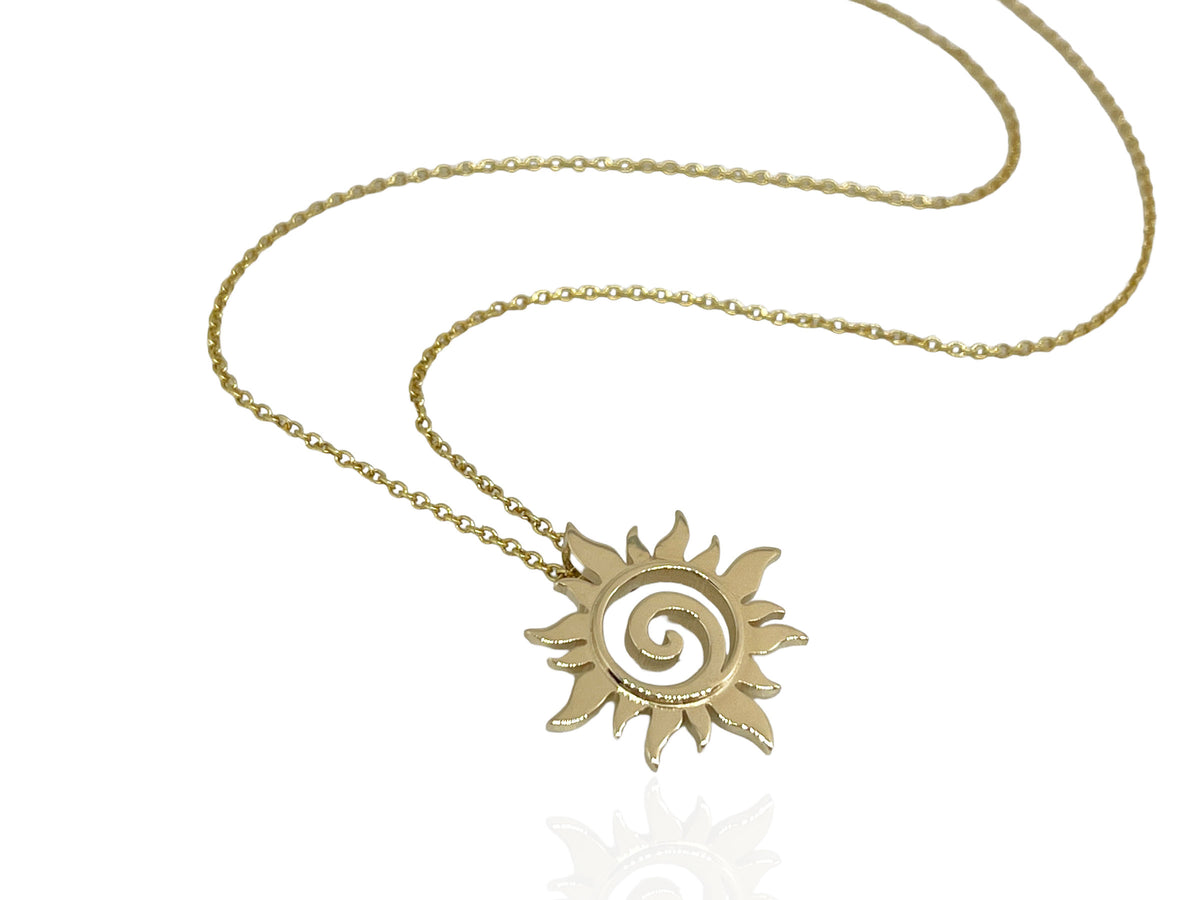 Alternate view of the gold sun swirl pendant on its chain