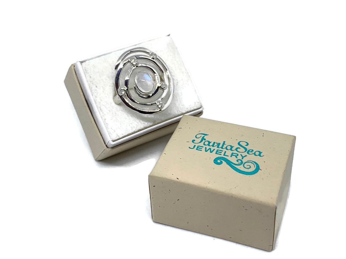 Hurricane-inspired Eye of the Storm ring in sterling silver with a moonstone at the center of the swirl