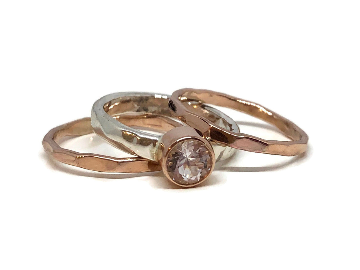 Round faceted pastel pink morganite in 14kt rose gold on a sterling silver ring stack set