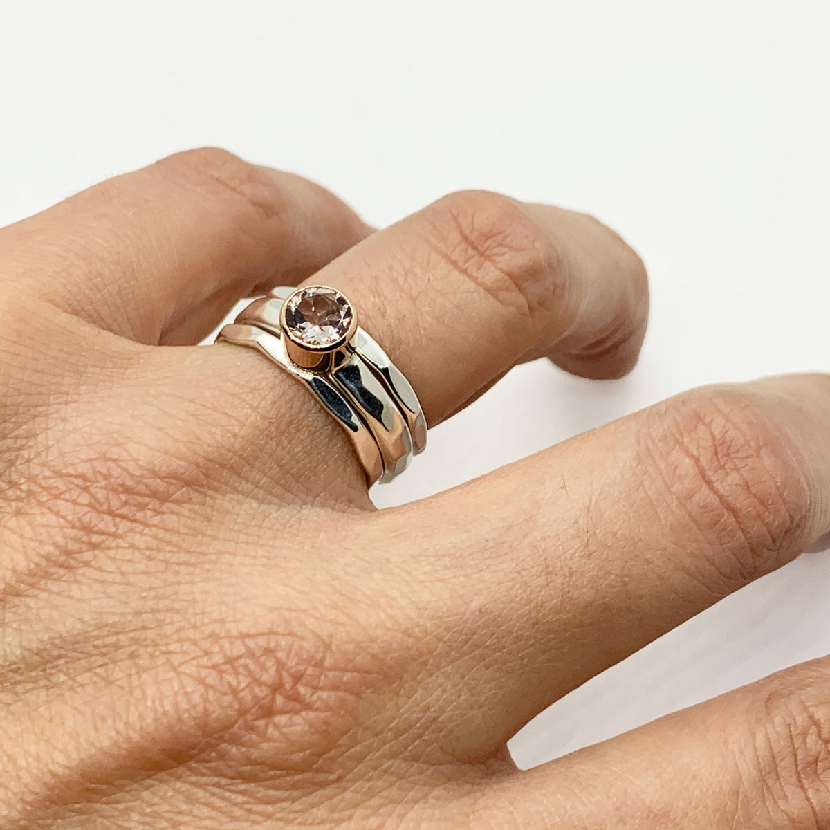 Morganite ring shown with sterling silver stack bands