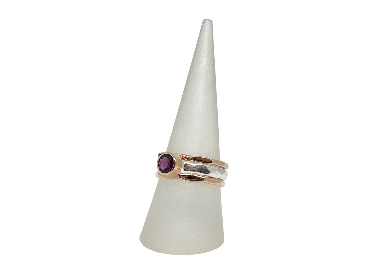 Side view of the rhodolite garnet stack ring showing the hammered silver band