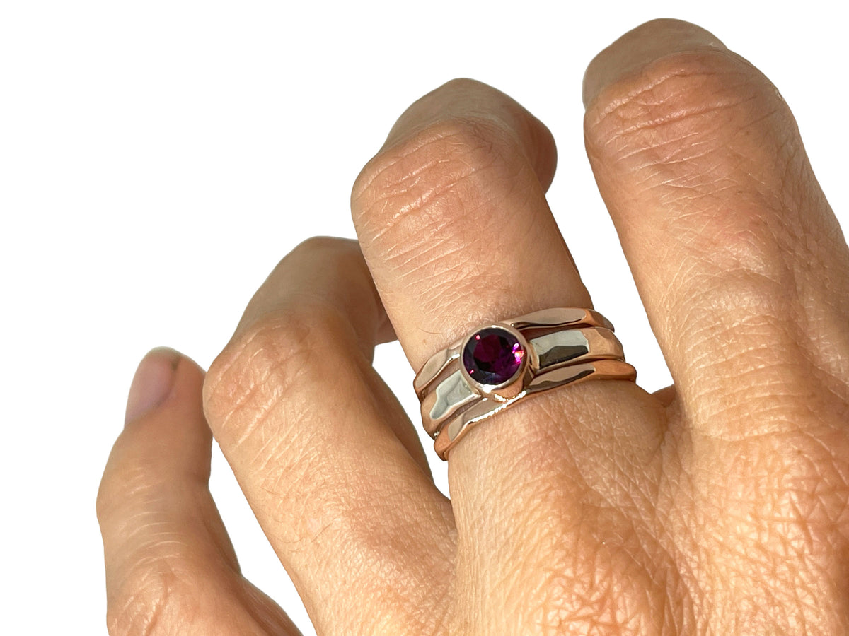 Another angle of the rhodolite garnet ring with silver and rose gold stack bands