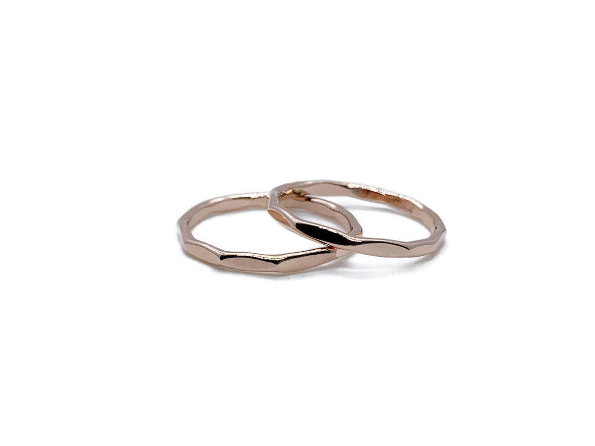 Set of two hammered 14kt rose gold stack bands with a mirror finish