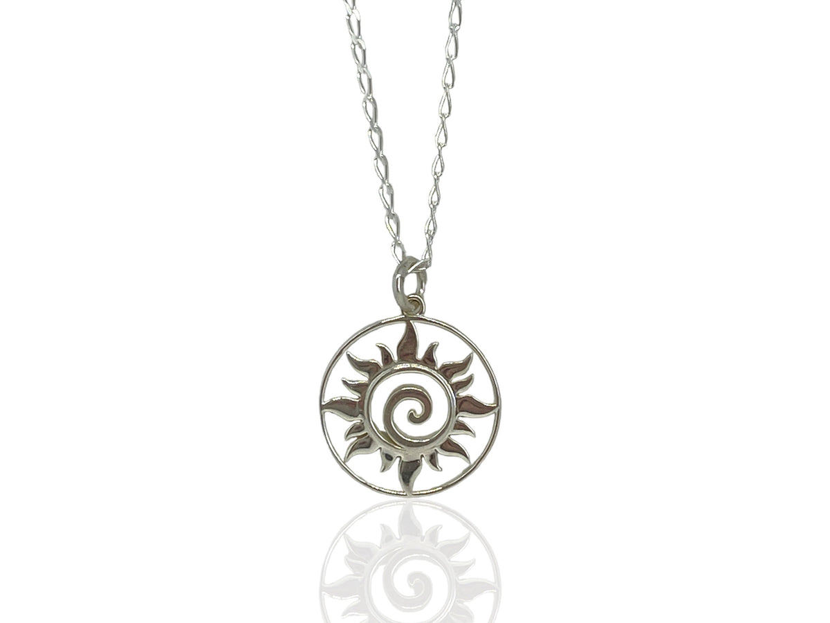 Small sterling silver sun swirl medallion pendant with rays spiraling around the center