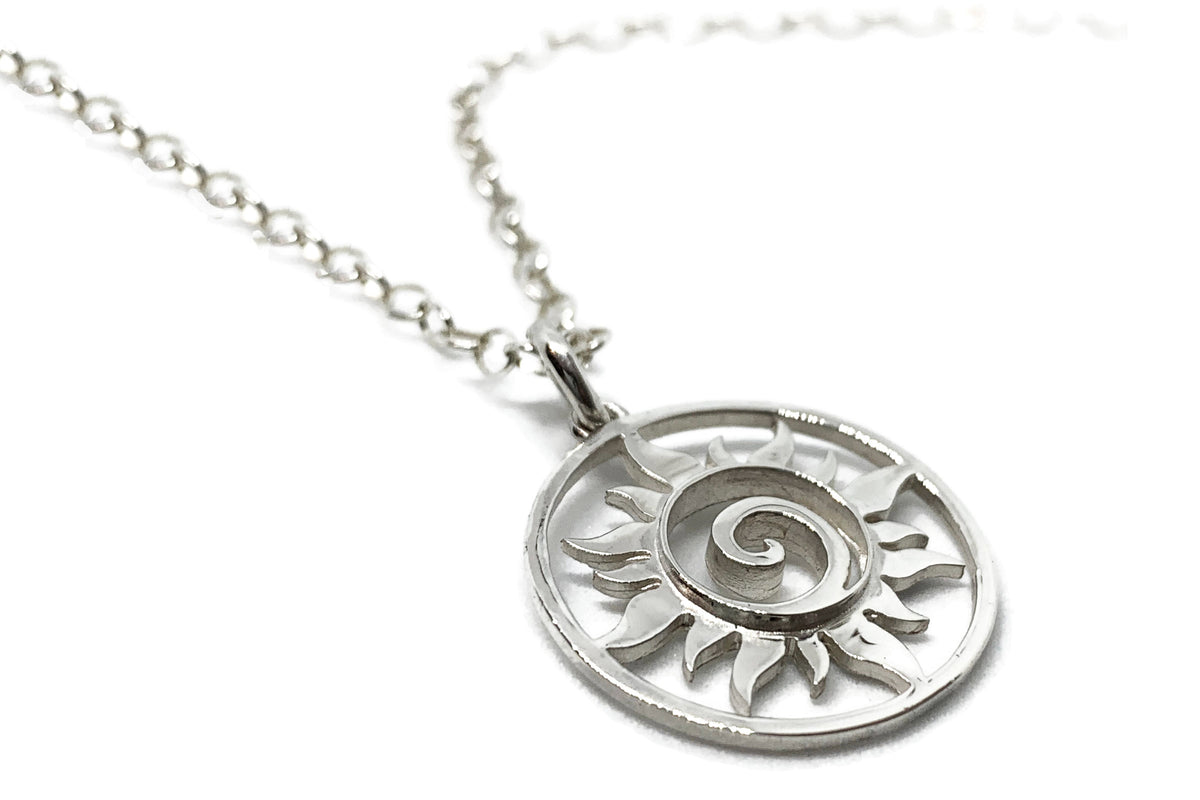 Alternate view of the small silver sun swirl medallion