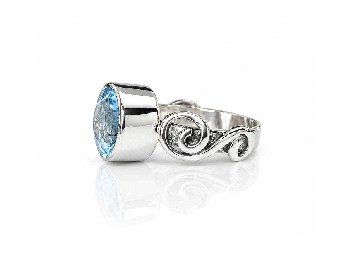 Silver Swirl Ring with Large Bezel Set Blue Topaz