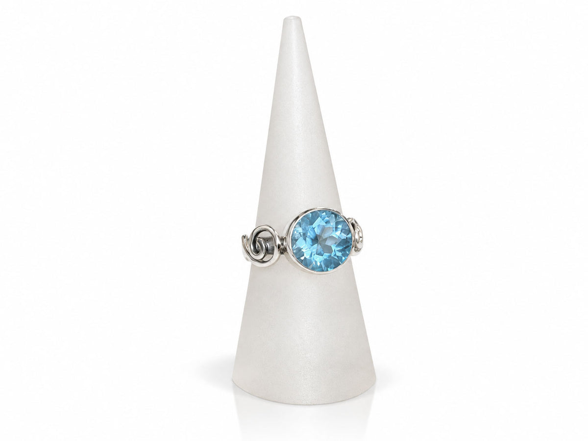 Silver Swirl Ring with Large Bezel Set Blue Topaz