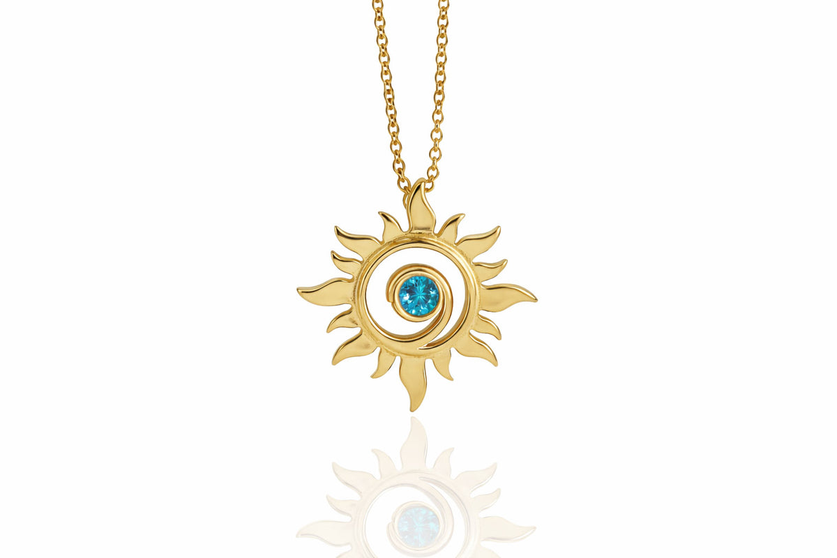 Gold Sun Swirl Pendant with Blue Diamond