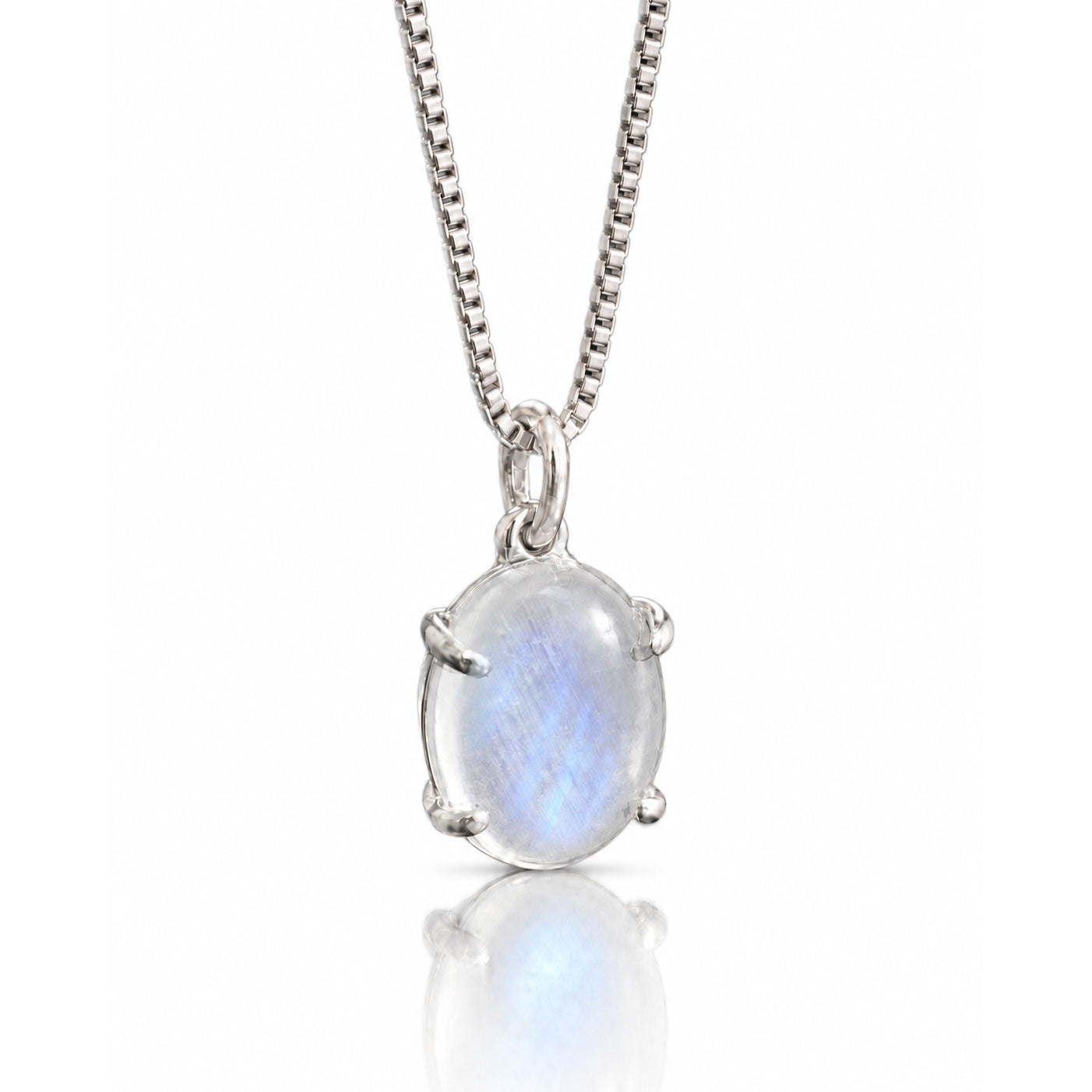 Oval moonstone with blue flash in an open-back, hand-fabricated sterling silver prong pendant