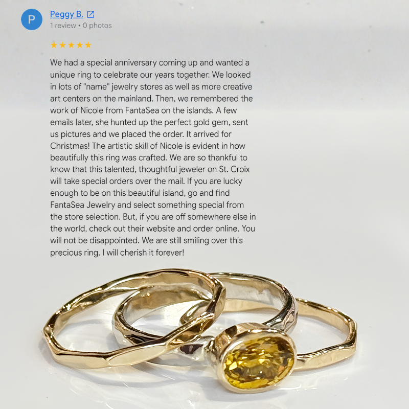 A gold ring with a yellow gemstone set in a three-prong setting, shown below a customer review text header on a white background.